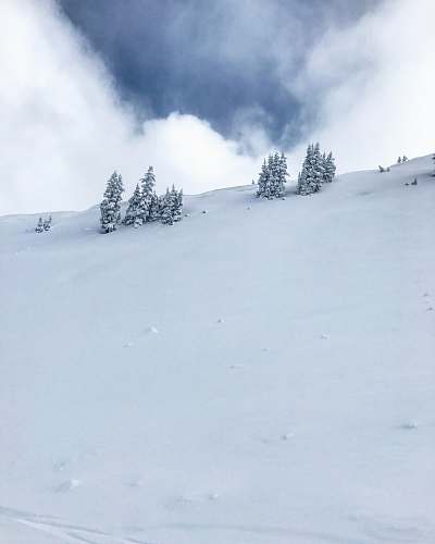 alta photo of mountain covered by snow under cloudy sky ut 84092